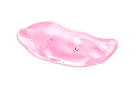 Beautiful pink transparent smear of hyaluronic acid on a white background isolated. Antibacterial gel. Face serum is smudged. Products for makeup and skin care. Organic cosmetics. Cosmetology. Closeupの写真素材