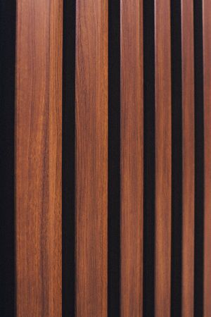 Brown vertical wooden background. Wood wall vertical line. Empty wooden board background.の写真素材