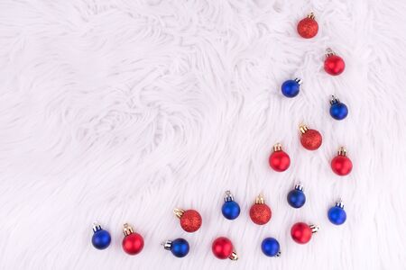 Christmas red and blue balls on white background. New year. Christmas composition. Flat lay, top view, copy space.の写真素材
