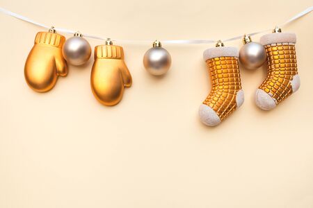 Christmas balls and Christmas socks on light background. Christmas background. Copy space for your text. Flat lay style. Top view.の写真素材