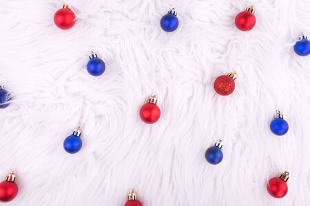 Christmas red and blue balls on white background. New year. Christmas composition. Flat lay, top view, copy spaceの写真素材