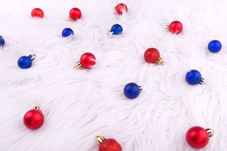 Christmas red and blue balls on white background. New year. Christmas composition. Flat lay, top view, copy space.の写真素材