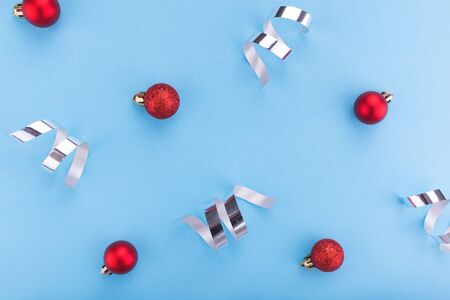New year and Christmas concept. Christmas balls on blue background. Flat lay, copy space, top view. Christmas composition.の写真素材