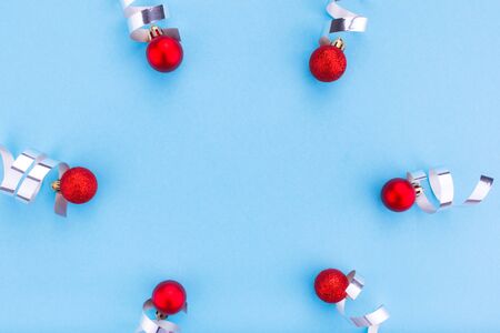 New year and Christmas concept. Christmas balls on blue background. Flat lay, copy space, top view. Christmas composition. Space for text.の写真素材
