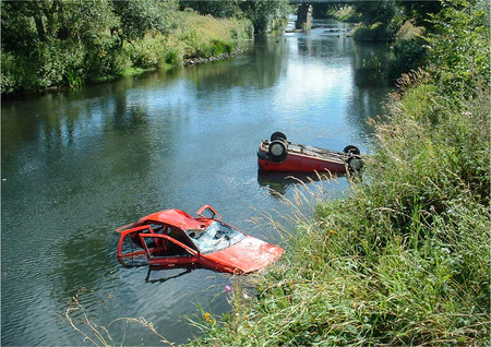Over-flow car park, Vehicles abandoned in river.の写真素材