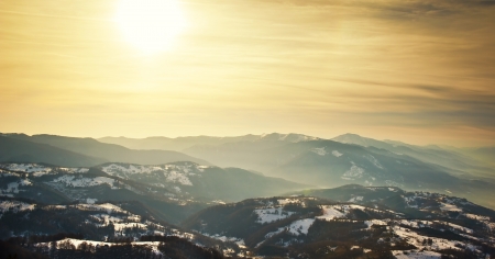Majestic sunset in the mountains landscape  Sunset landscape in Carpathian mountains  Dawn in mountains Carpathians, Romania  Mountains covered with snowの写真素材