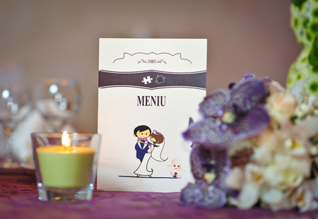 Wedding decorations with candle  Floral arrangements on wedding ceremony detail  Elegant wedding arrangement with flowers, candle and cardの写真素材