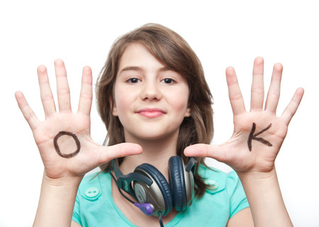 teen girl have fun with her hands. Focus on handsの写真素材