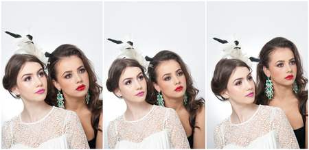 Hairstyle and make up - beautiful females art portrait. Elegance. Genuine natural brunettes with accessories in studio. Portrait of two attractive women with creative makeupの写真素材