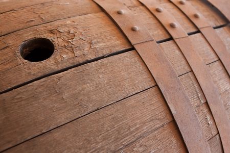 Close up of the tap hole on an old wine vat with steel ringsの写真素材