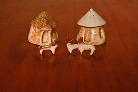  A set of clay African houses with clay cattle on a wood  backgroundの写真素材