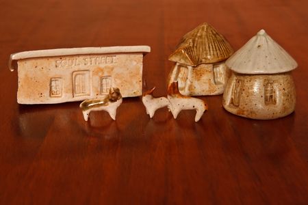  A set of clay African houses with clay cattle on a wood  backgroundの写真素材