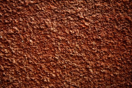  Red painted rough cement wall background textureの写真素材