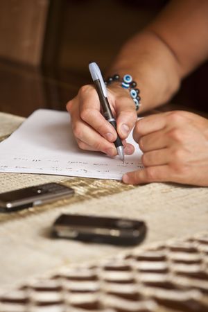 Young Male Hands writingの写真素材