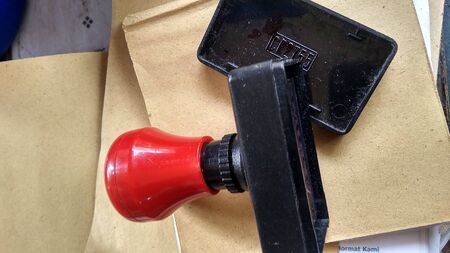 A stamp on a pile of books photo