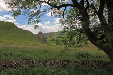 In the hills of England dry stone walls are made to divide fields as no hedges will grow in the...