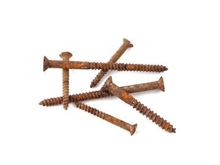 Rusty screws on a plane white background.の写真素材