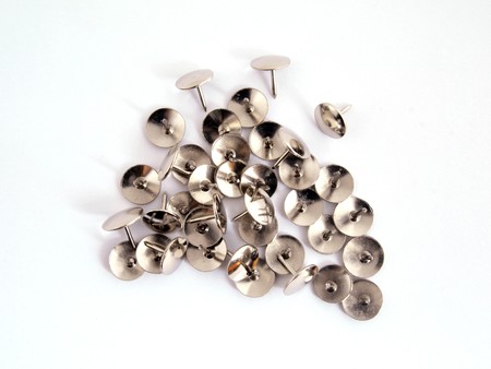 Thumb tack or drawing pin on a plain white background.