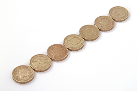 British, UK, pound coins on a plain white background.の写真素材