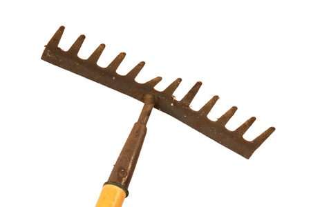 Old and rusty garden rake on a white background の写真素材