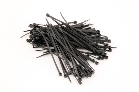 Black nylock cable ties on a white background 