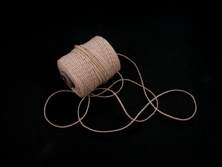 Ball of string or twine on a plain black background の写真素材