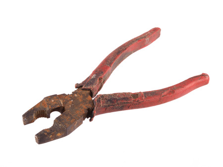 Close up of  old rusty pliers on a white background.の写真素材