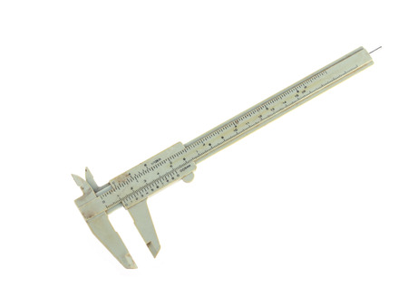 Close up photo of an old micrometer on a white background. の写真素材