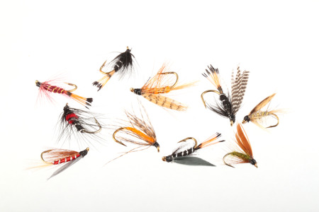 Handmade flies used by fishermen to attract trout and salmon by game fishermen.の写真素材