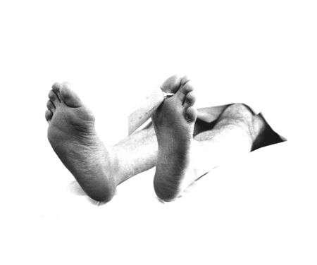 feet of a dead man, ID tag attached