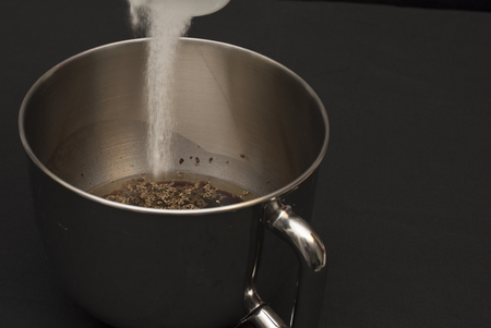 Planetary steel on a black background. Ingredients for cookies in red wine Taurasi ingredients. Red wine Taurasi, oil seeds, sunflower seeds, flax seeds, sugar, flour. Mechanical mixer, red and performing. wrong Google Translate for Business: Translator Tの写真素材