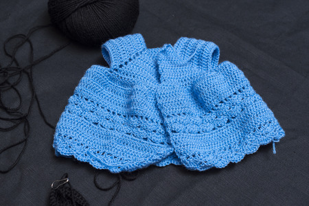Making a cloth doll, dressed in wool with hand-made, with crocheting follow paper template. Black...