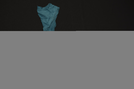 White Mask on black background covered with skinの写真素材