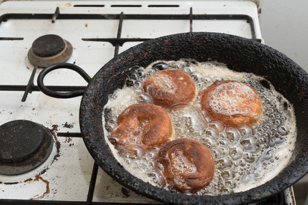 Donuts, pancakes, cakes italian on wooden cutting board.の写真素材