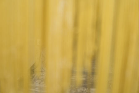 Handmade egg noodles resting on the wooden cutting board or left to dry.の写真素材