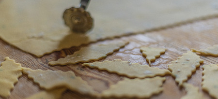 Lagane. Homemade Italian pasta. Hand cut on wooden chopping board. Excellent with legumes, chickpeas or beans and seafood. Handcrafted processing techniques.の写真素材