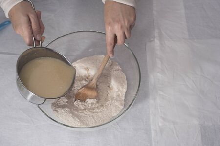 Preparation and mixing of the ingredients for making a spice plumcake.の写真素材