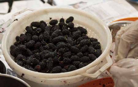 Jam Mulberry balcks. Preparation. Fruits in the pot whit chopped sugar and strawberries.