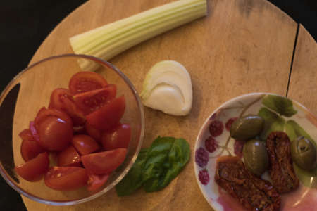 Ingredients for pasta salad, cherry tomatoes and other raw vegetablesの写真素材