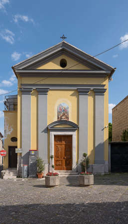 Church of San Michele Arcangelo, view of an alley in the historic center of Airola (Bn) in Campania. Wooden portal with the image of the Saint.の写真素材