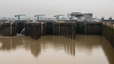 Cardiff Bay barrage including control building. Seaward side of barage between Queen Alexandra Dock and Penarth Head in Cardiff, Wales, UKの写真素材