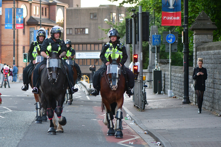 CARDIFF, UK - 3 JUNE 2017 Mounted police ensure safety during Champions League Final. British police and security services on high alert as hundreds of thousands of fans enjoy football in the capital of Walesのeditorial素材