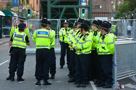 CARDIFF, UK - 3 JUNE 2017 Large group of police during Champions League Final. British police and security services on high alert as hundreds of thousands of fans enjoy football in the capital of Walesのeditorial素材