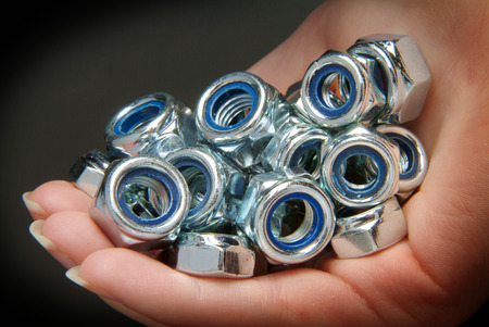 Hand holding locknutsの写真素材