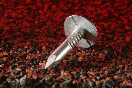 clout nail on shingle backgroundの写真素材