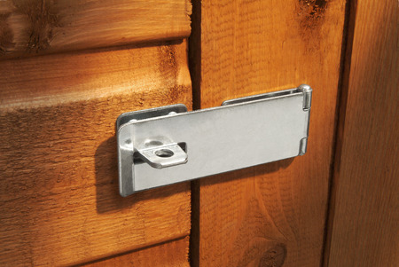 Closed hasp on shed door without padlockの写真素材