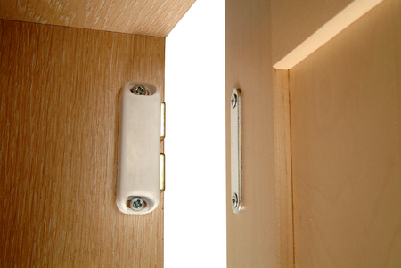 Magnetic catch on cabinet doorの写真素材