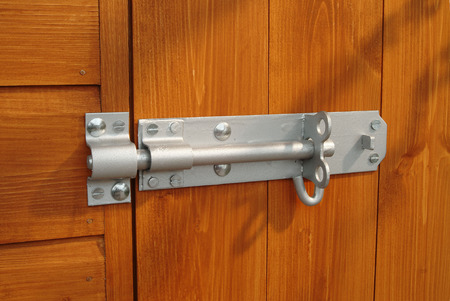 Padbolt without padlock on shed doorの写真素材