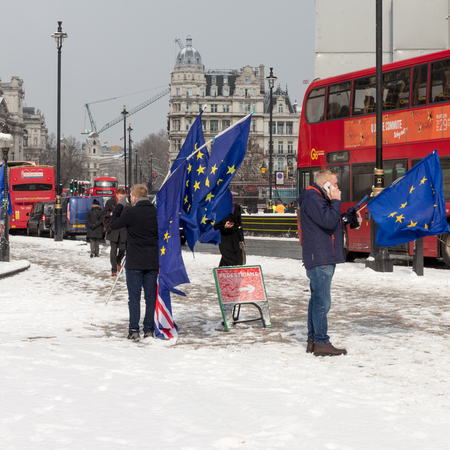 London, UK; 28th February 2018; Anti-Brexit Campaigners Wave European Flags Outside Houses of Parliamentのeditorial素材