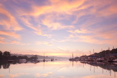 Beautiful dawn sky over the tidal River at Penryn Cornwall England UK